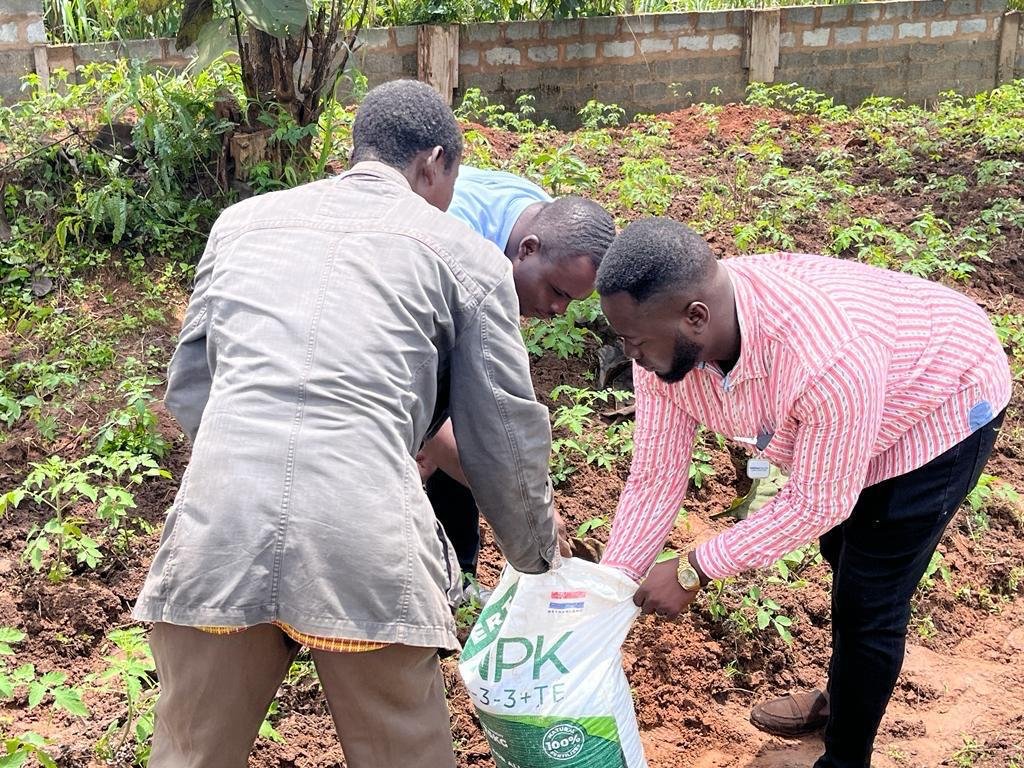 FCL team applying fertiliser in the field